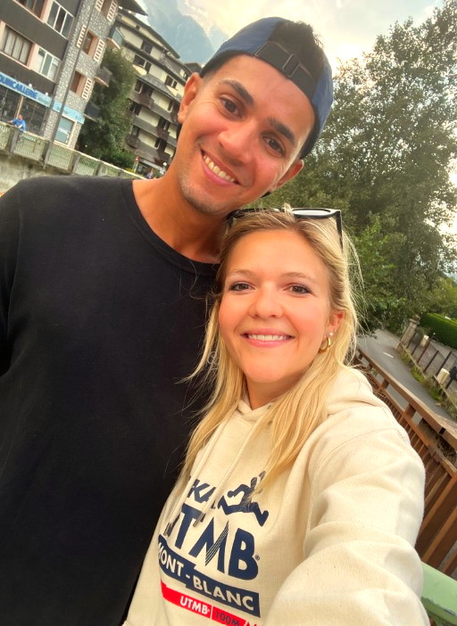 Laura and Nau smiling together on a balcony in Tromsø